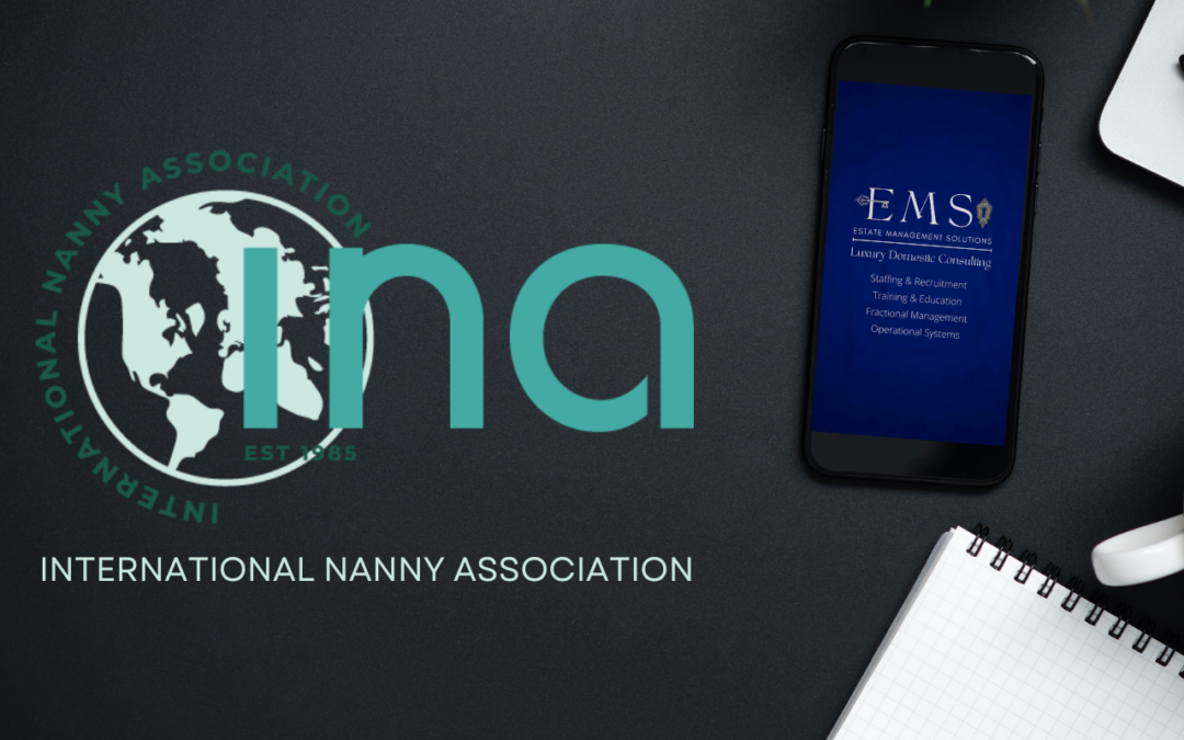 nternational Nanny Association's branding with a smartphone on a professional desk setup.